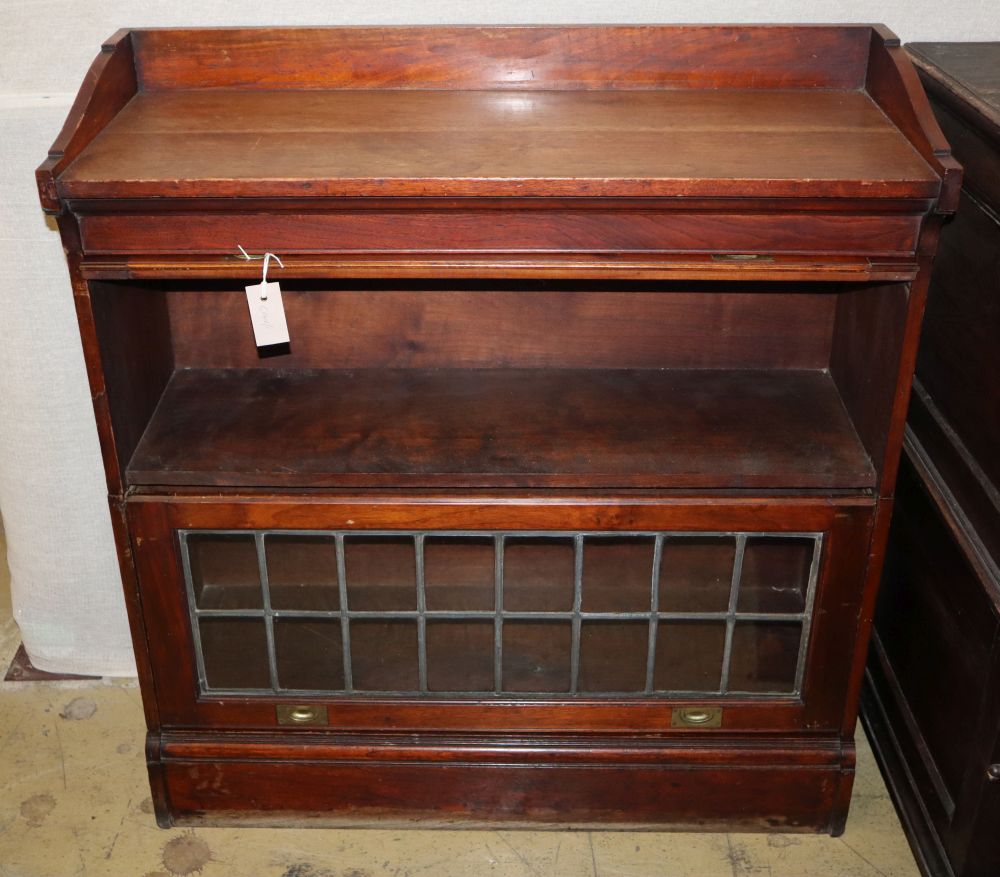 A Globe Wernicke style two section walnut leaded light bookcase, W.92cm, D.36cm, H.96cm
